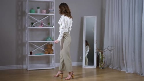 Stylish Woman Posing in Elegant Fashion Outfit Indoors