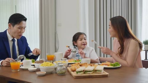 Family Enjoying Breakfast Together at Home
