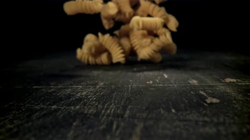 Dry Pasta Falls on the Table Filmed on a Highspeed Camera at 1000 Fps