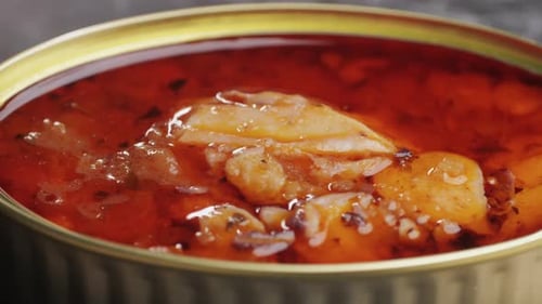 Opening Canned Octopus Squid Fish Can Man Open the Canned Seafood on the Table Close Up on