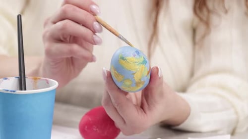 Woman Painting Decorative Easter Egg