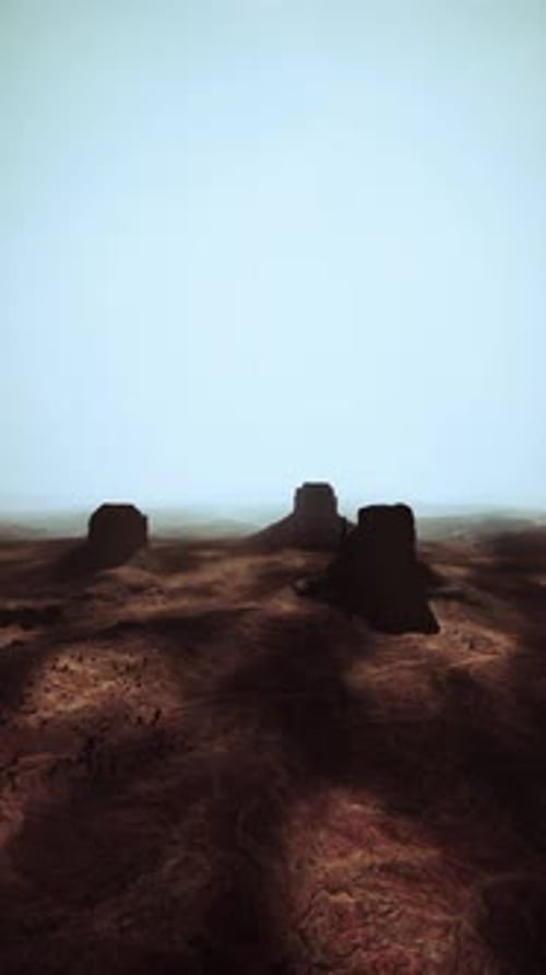 Arid Desert Landscape With Distant Rocks