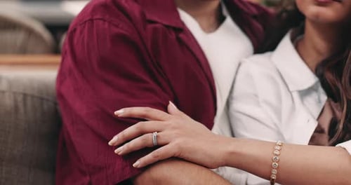 Close Up of Couple's Hands Displaying Engagement Ring