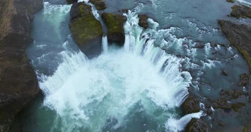 Breathtaking Aerial View of Cascading Waterfalls and Majestic Icelandic Landscapes