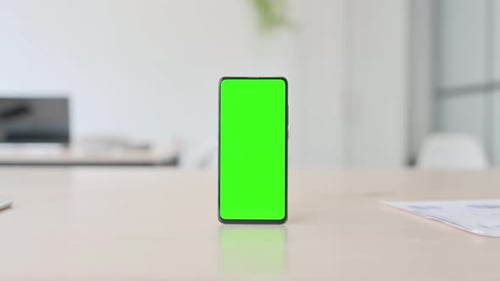 Green Screen Smartphone on Desk in Office
