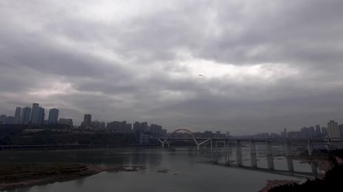 Airplane leaving ChongQing city with river and cityscape in background.Static shot