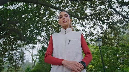 Fitness Girl Looking Smartwatch at Daily Training in Green Lush Park Closeup
