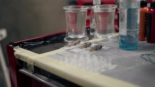 Close-up - tattoo equipment in a tattoo studio, tattoo machine needles