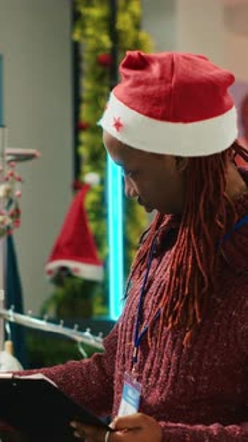 Vertical Video Manager Checking Clothing on Racks
