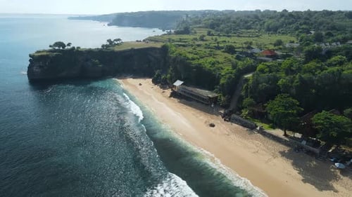 Drone View of Sandy Beach with Scenic Rock and Blue Ocean in Bali Balangan Beach