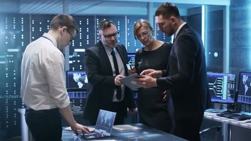 Team of Government Officials Have Constructive Discussion in Monitoring Room. Man Holds Tablet, Lap