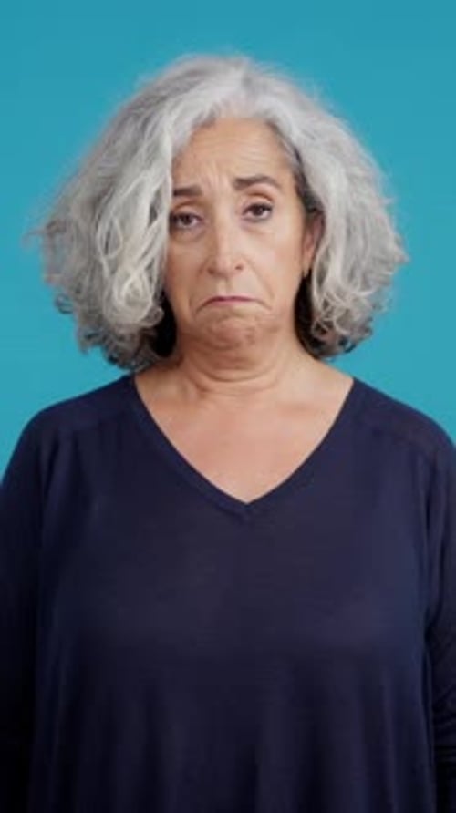 Senior Woman Looking Down Then Upward Portrait