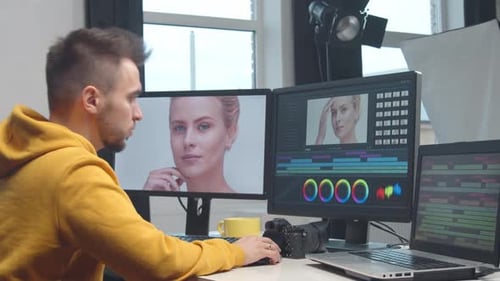 Freelance Videographer Colorist Editing Footage Using Professional Software Monitor and Montage