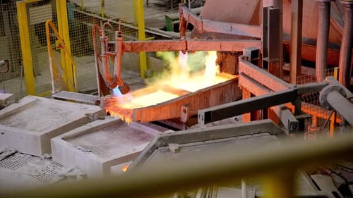 Molten Metal Pouring Into Molds in Factory