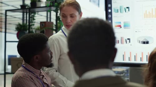 Business Presentation of Financial Charts in Modern Office