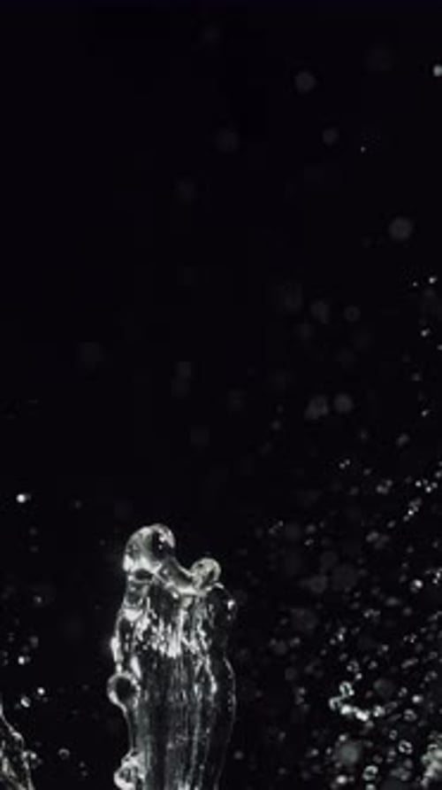 Elegant Water Splash in Dramatic Close Up, Black Background
