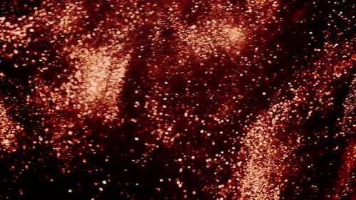 Estrellas bokeh resplandecientes sobre una tormenta de partículas doradas