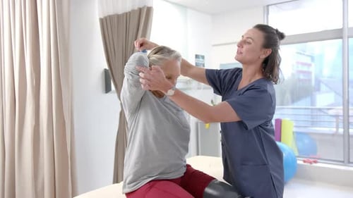Senior Woman Does Therapy with Resistance Band