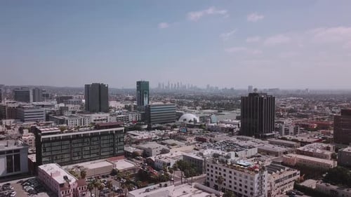 LA: Drone shot over Hollywood looking out towards the Downtown Skyline on a bright clear day