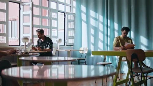 Freelancers Sitting Cafe Coworking Place Under Soft Sunlight Visitors Relaxing