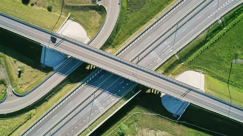 Transport Interchange on the Highway Aerial of Cars Drive Along the Highway Outside the City