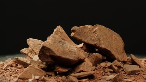 Delicious Dark Chocolate Chunks Piled High on Dark Background