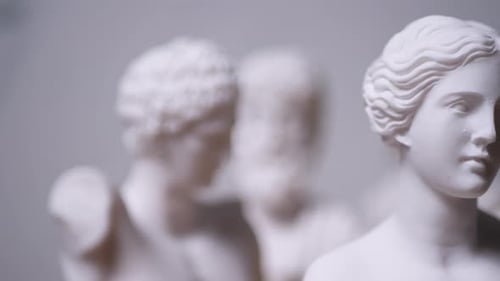 Statue of Greek Goddess Aphrodite with others out of focus - Left to Right