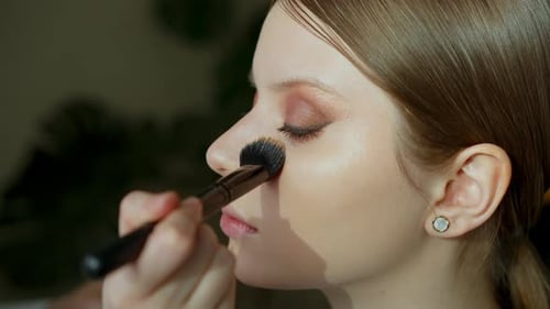 Makeup Artist Work in Her Beauty Studio Portrait of Woman Applying By Professional Make Up Master