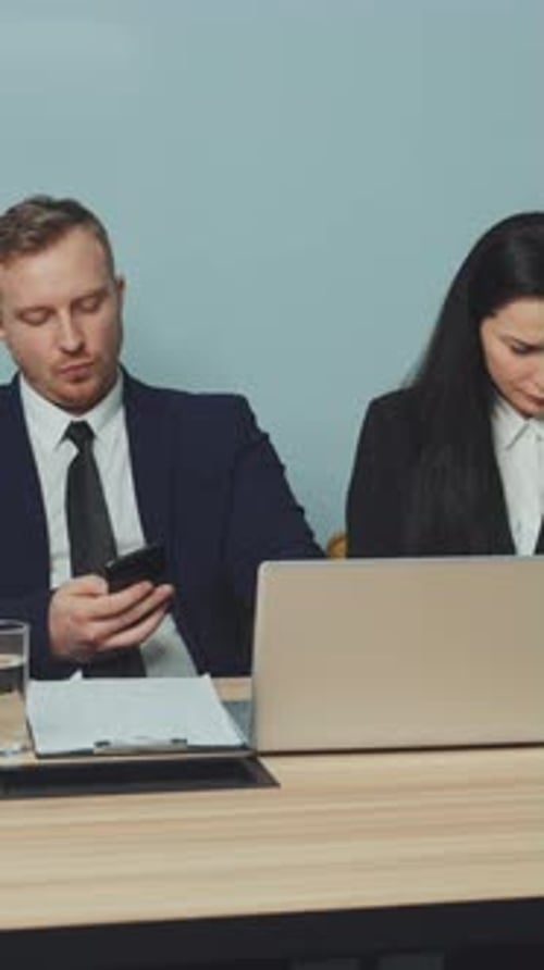 Vertical Screen Business Team Distracted By Smartphones