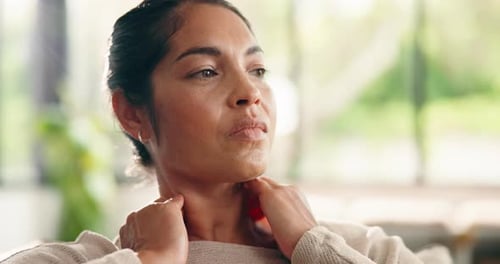Woman Massages Her Stiff Neck Inside Home During Day