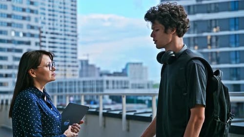 Woman Teacher and Guy Student Shaking Hands When Meeting Talking Outdoor