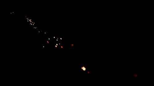 Animated Flow of Glowing Particles on Black Backdrop