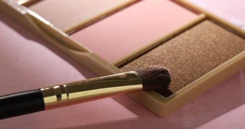 Close Up of Makeup Palette and Brush