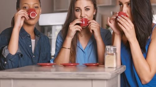 Three Young Women Enjoying Coffee at Home