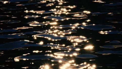 The sea's surface glittered with sparks.
