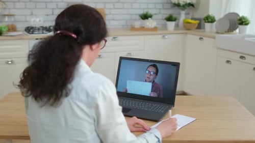 Woman Learning Online with Remote Tutor at Home