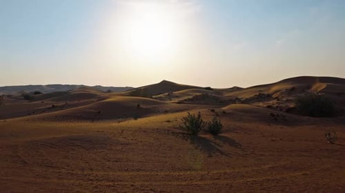 Drone View of Sunset Over Sand Dunes in Dubai Desert