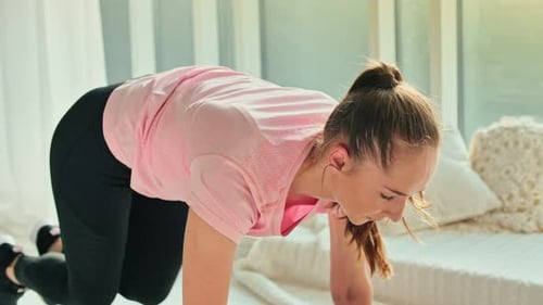 Woman Works Out at Home Doing Mountain Climbers