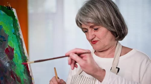 Senior Woman Painting Abstract Picture on Easel