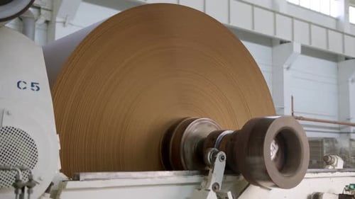 Coil with Brown Packaging Paper on Automatic Production Line