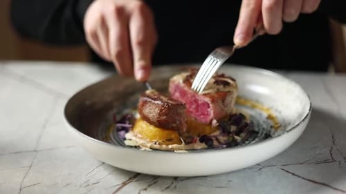 delicious meat in medallions on a plate in a restaurant. cuts a steak