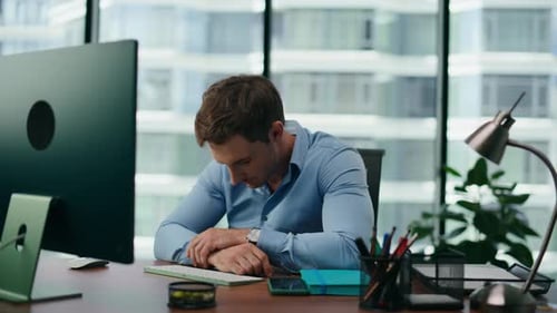 Portrait Depressed Office Manager Shocked by Business Failure Sitting at Desk Computer