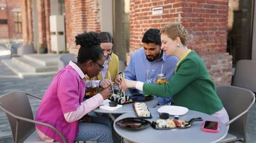 Friends Enjoying Sushi Outdoors