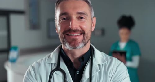 Smiling Doctor Wearing Stethoscope in Hospital