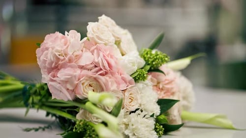 Closeup in Flower Shop on a White Table Lies a Readyassembled Gently Pink Bouquet As a Gift for your