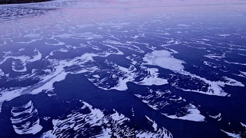 Spectacular drone footage of immense ice floes on the water's surface.