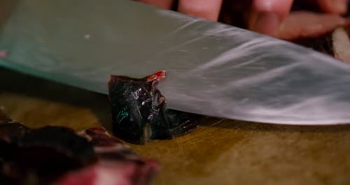 Close up view of Chef slicing the steak with Steel knife. Prepare meat before cooking, steak, bbq, m