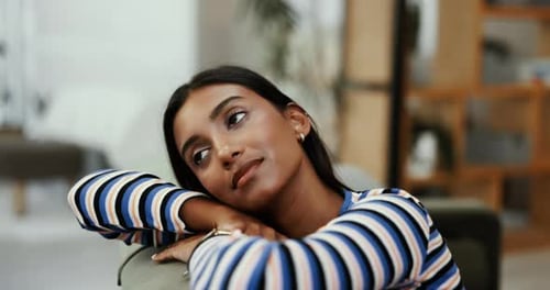 Relaxing Woman Resting on Sofa at Home