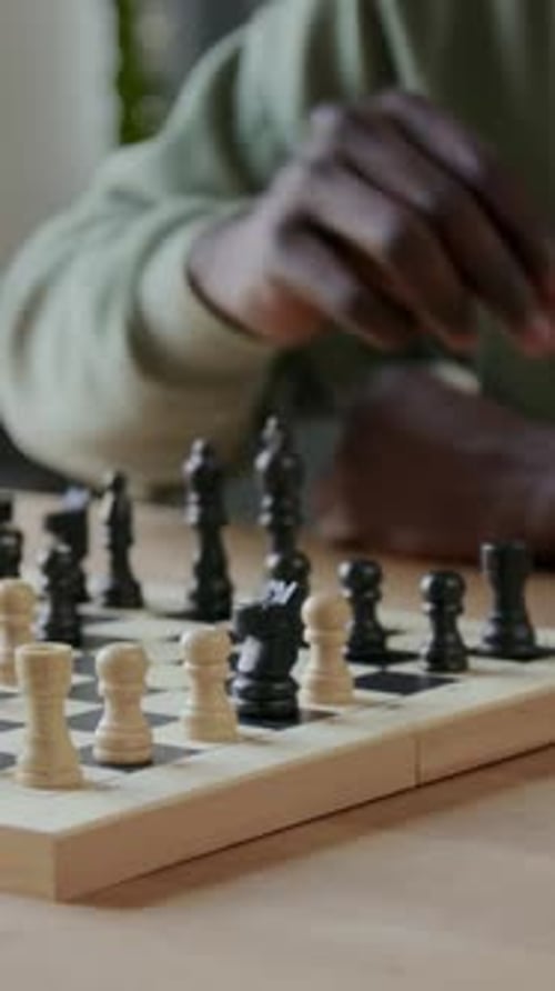 Hand Moving Pieces on Chessboard Close Up