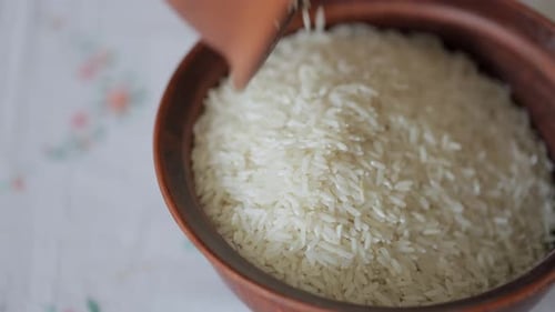 Rice Being Poured into a Bowl Close Up
